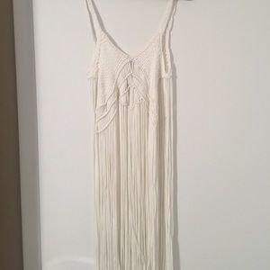 White top with hanging strings